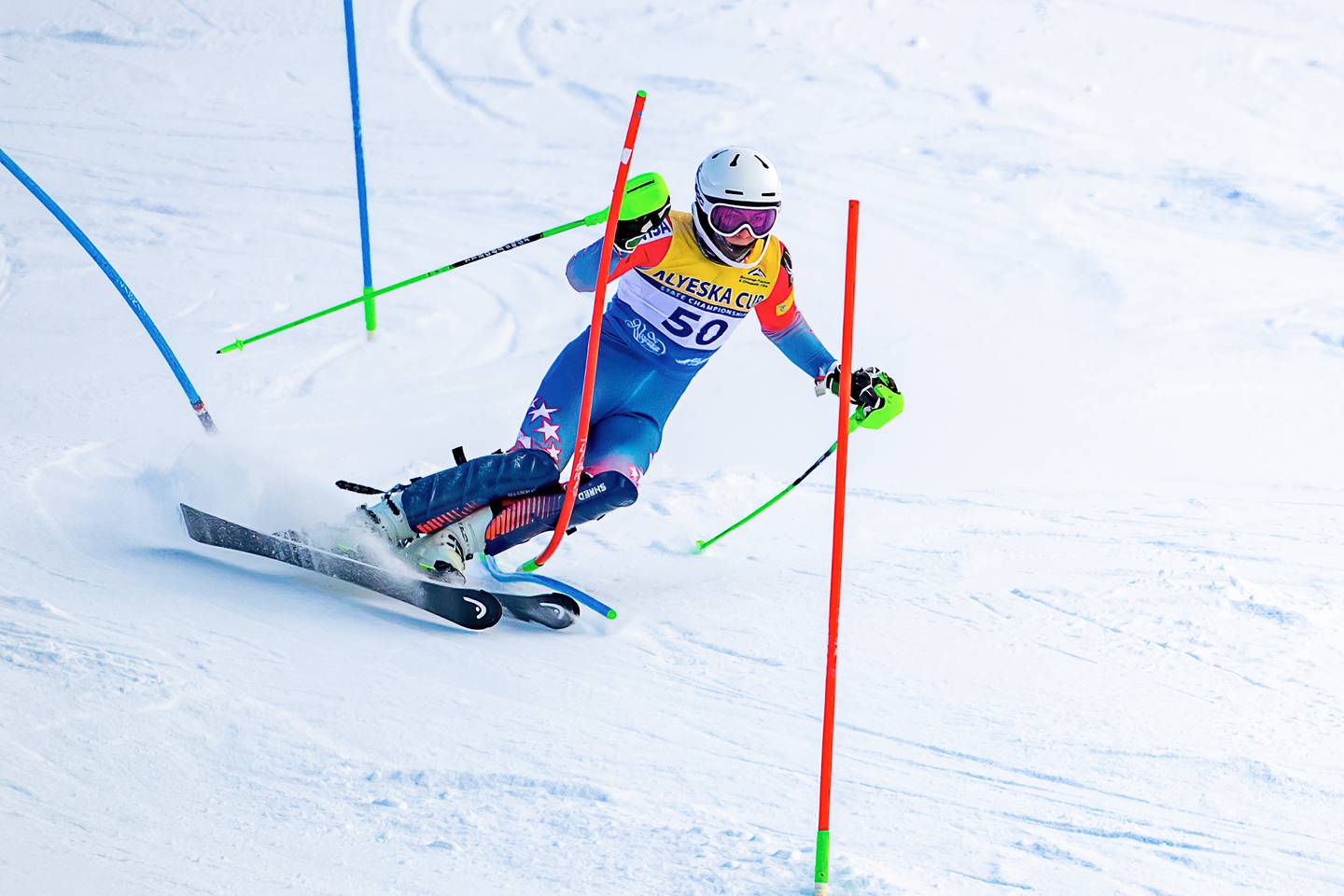 Finnigan Donley adopts a narrow -- and risky -- stance and rides on the outside edge of his inside ski to straighten out a hairpin during slalom racing Sunday on the Tanaka Hill at Alyeska Resort. The maneuver helped contribute to a winning margin of about seven seconds. (Photo by Bob Eastaugh)